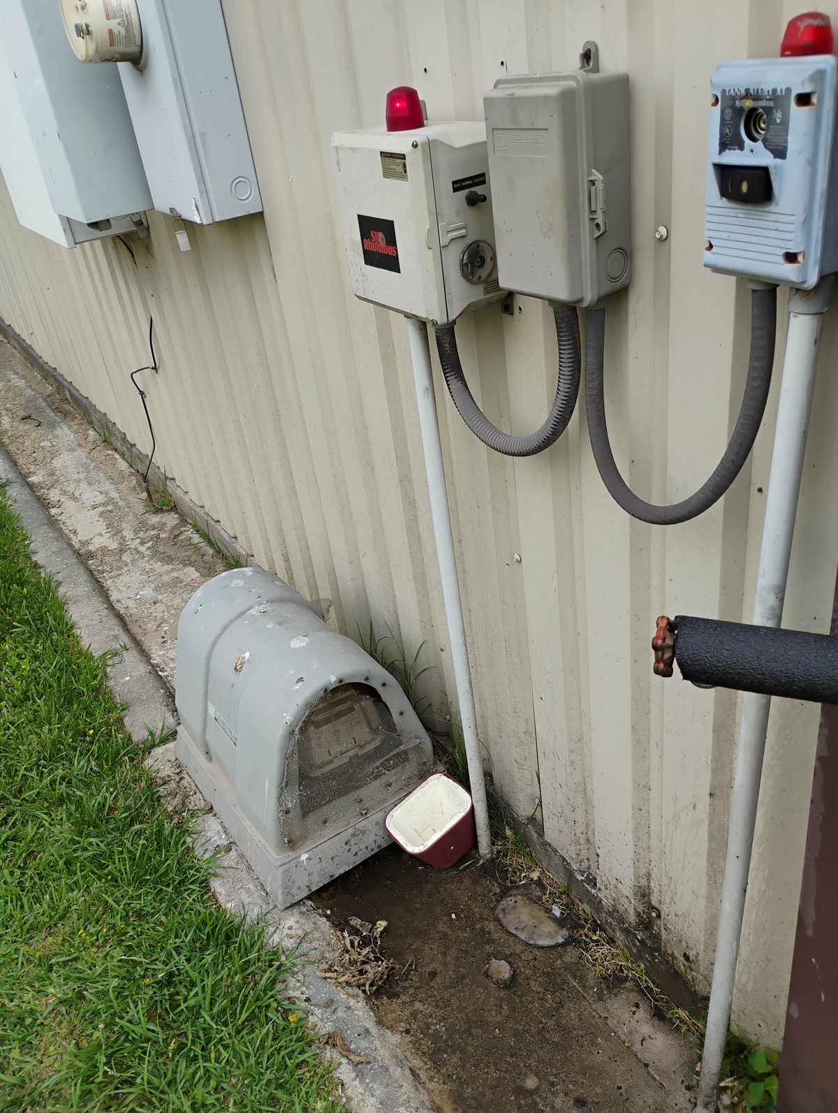 Aerobic system control panel with alarm light and SJE Rhombus panel — Harris County Septic provides 24/7 emergency service